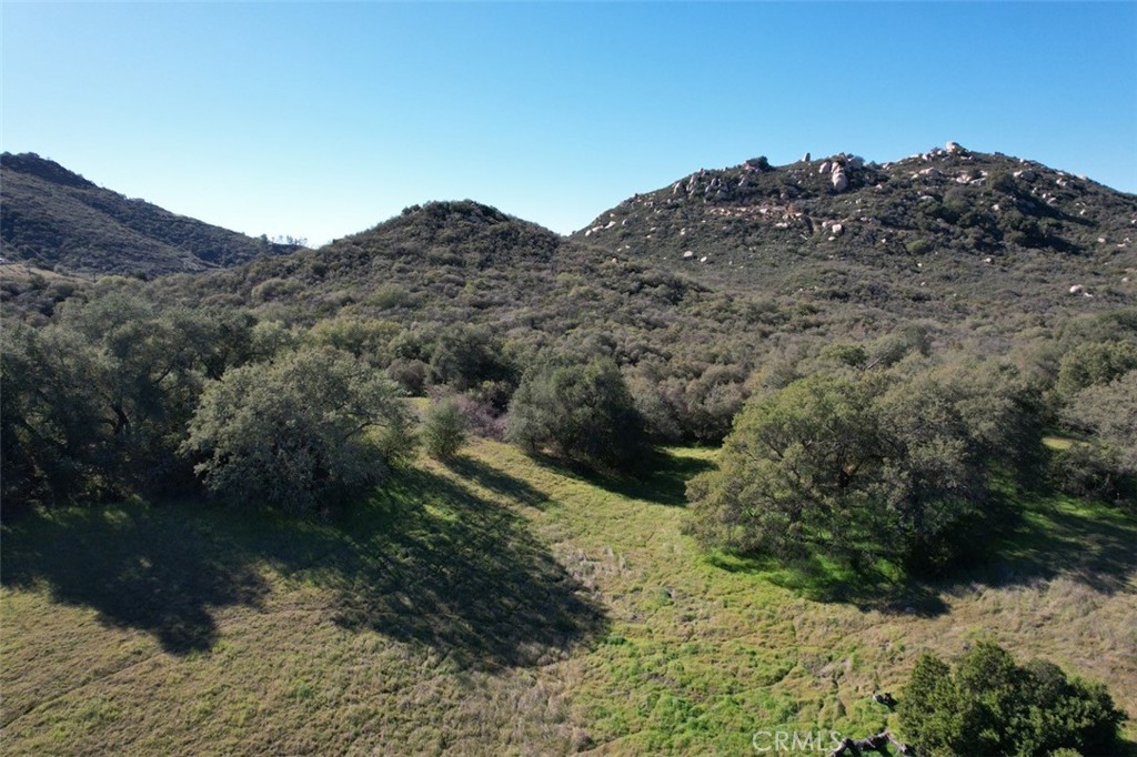 0 Tenaja Road Murrieta, CA 92562 - Photo 4 of 28 a view of a dry yard with mountains in the background