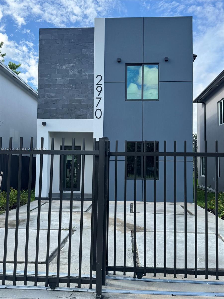 2970 Northwest 45th Street Miami, FL 33142 - Photo 1 of 26 a view of entryway front of house