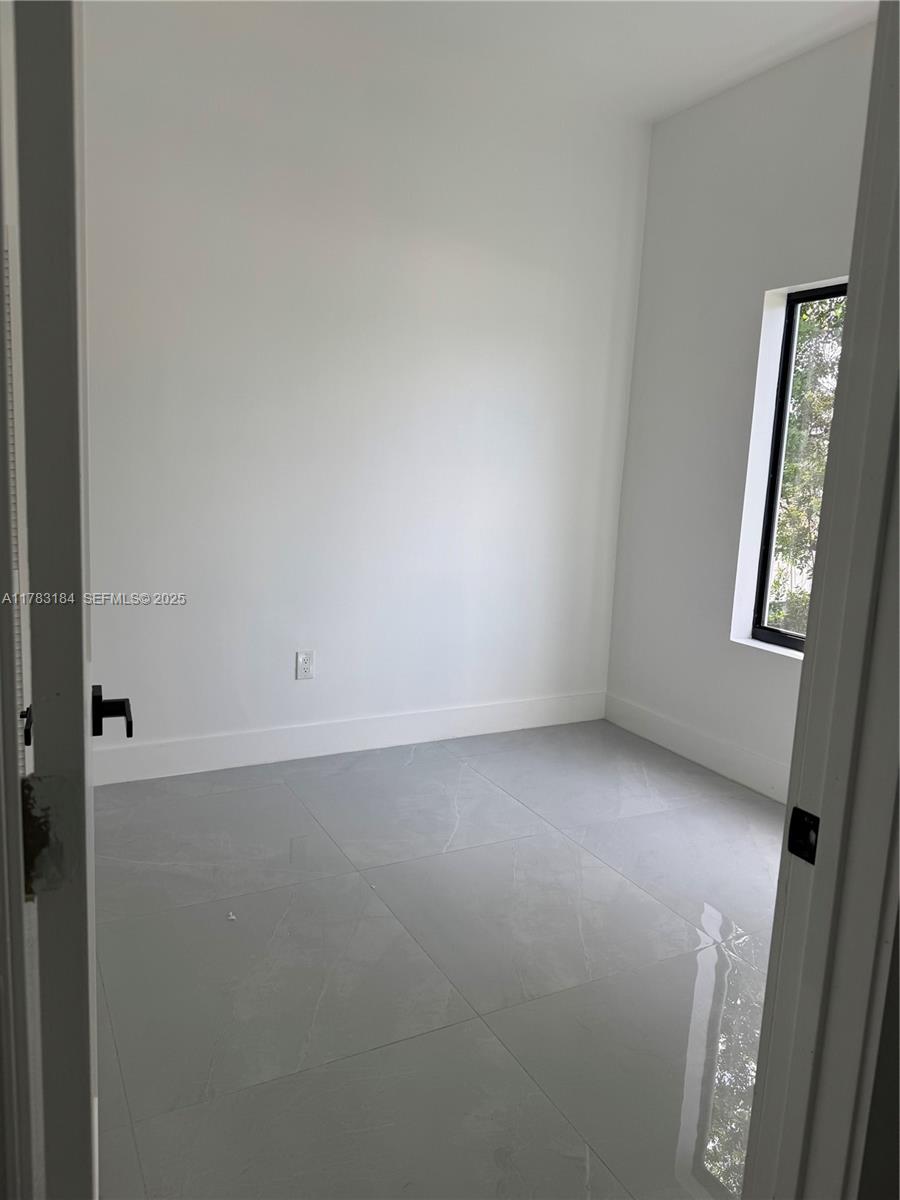 2970 Northwest 45th Street Miami, FL 33142 - Photo 13 of 26 an empty room with windows
