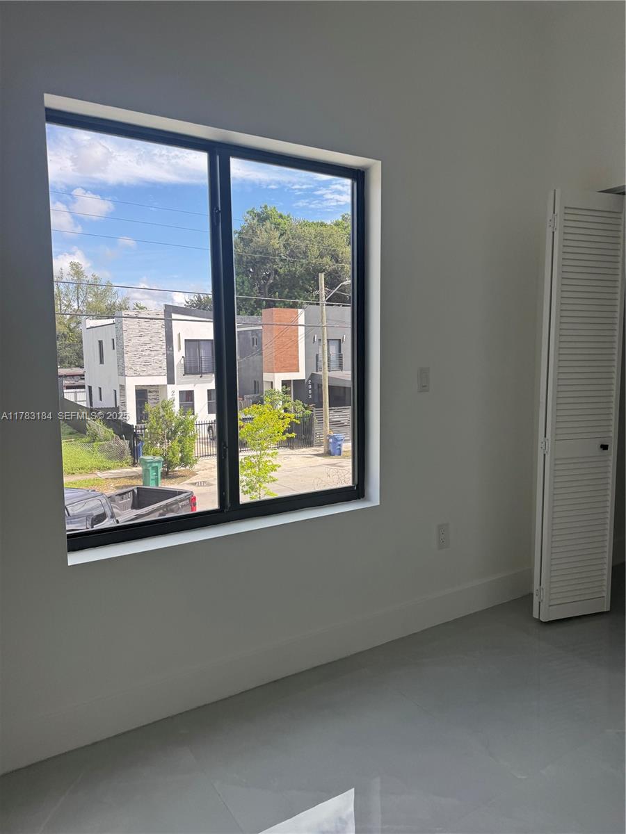 2970 Northwest 45th Street Miami, FL 33142 - Photo 19 of 26 an empty room with a window