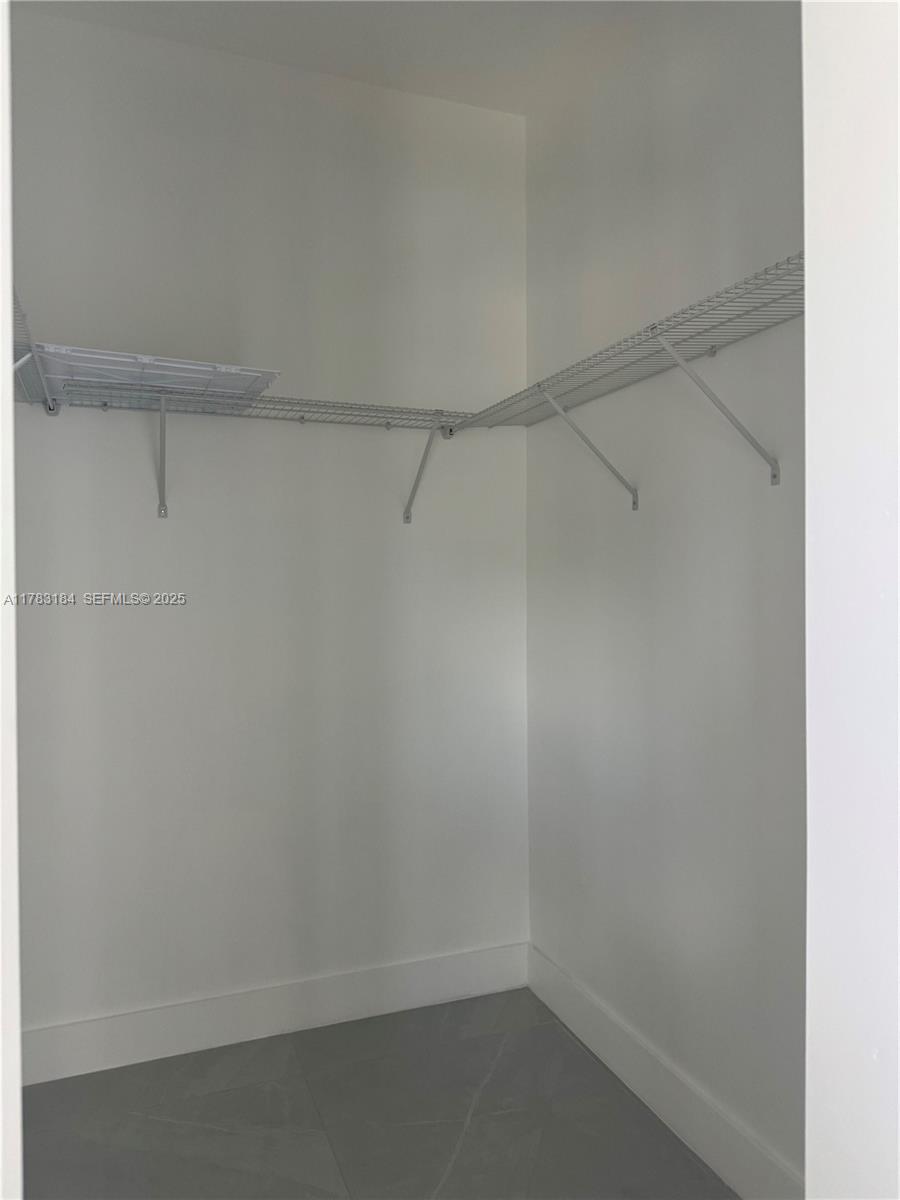 2970 Northwest 45th Street Miami, FL 33142 - Photo 20 of 26 a view of an empty walk in closet