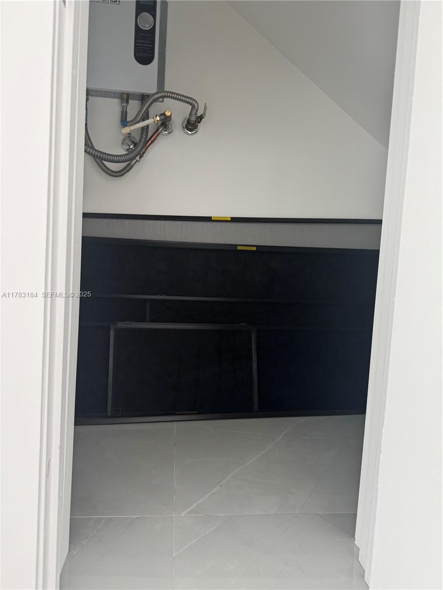 2970 Northwest 45th Street Miami, FL 33142 - Photo 6 of 26 a bathroom with a sink and a mirror