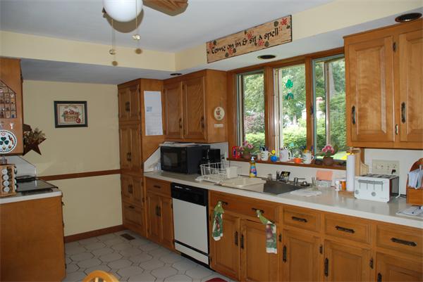 38 Endecott Street Springfield, MA 01118 - Photo 4 of 17 a kitchen with a sink a counter top space and cabinets