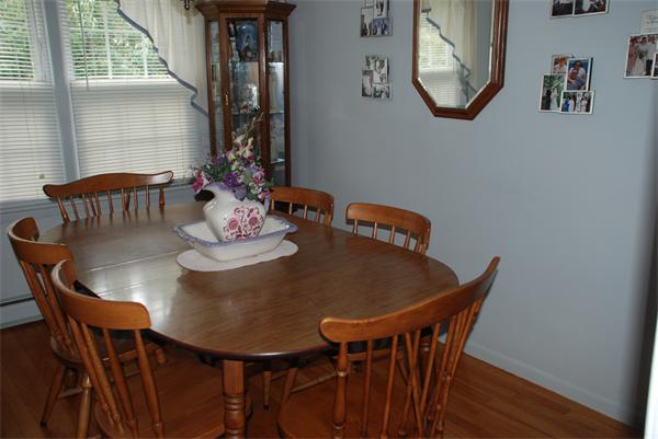 38 Endecott Street Springfield, MA 01118 - Photo 5 of 17 a view of a dining room with furniture and wooden floor