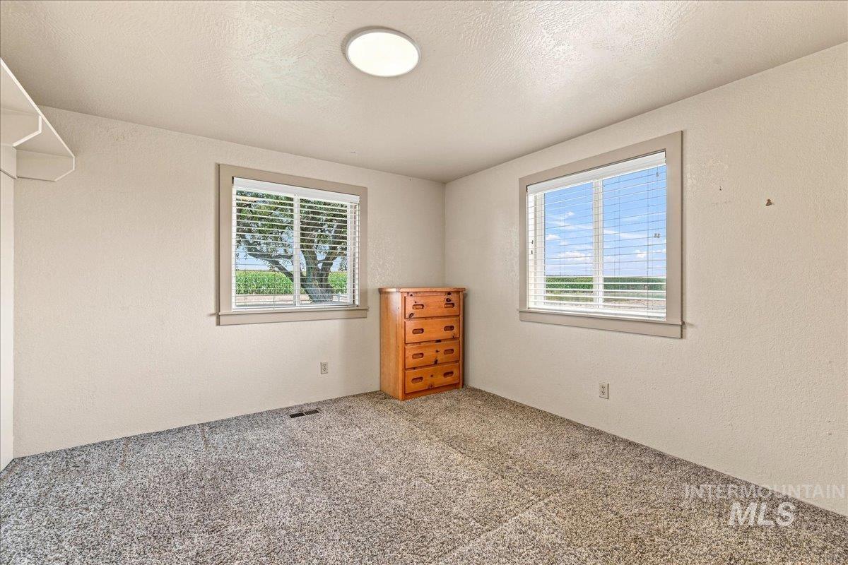 26201 Hop Road Caldwell, ID 83607 - Photo 24 of 45 Carpeted flooring, recessed lighting, and two windows with blinds