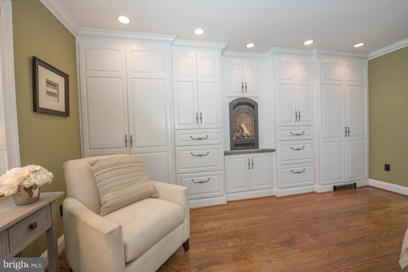 406 Homestead Road Wayne, PA 19087 - Photo 18 of 39 Master Bedroom with gas fireplace and built-ins
