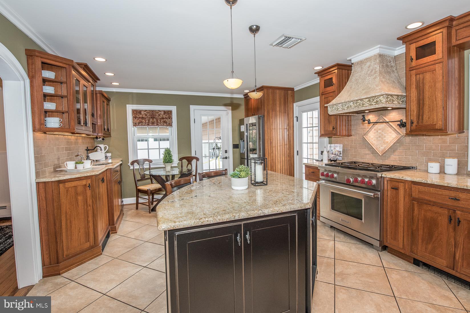 406 Homestead Road Wayne, PA 19087 - Photo 9 of 39 Kitchen island with Subzero wine refrigerator