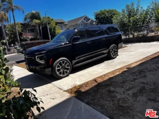 a view of a roof deck with furniture