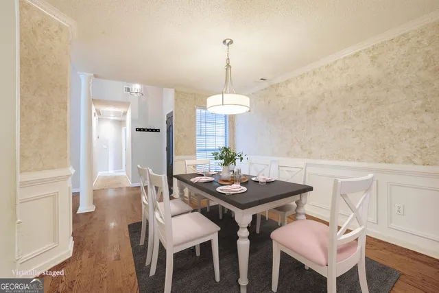 a view of a room with wooden floor and window