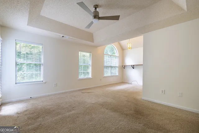 a kitchen with kitchen island granite countertop a sink stove and cabinets