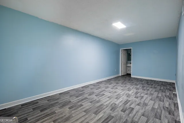 a bathroom with a bathtub and a window
