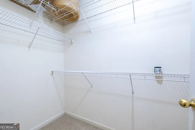 a kitchen with stainless steel appliances granite countertop a refrigerator and a stove