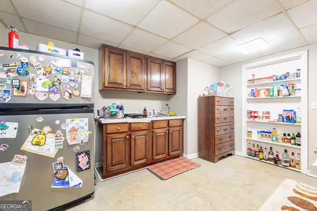 a living room with furniture a rug and a chandelier