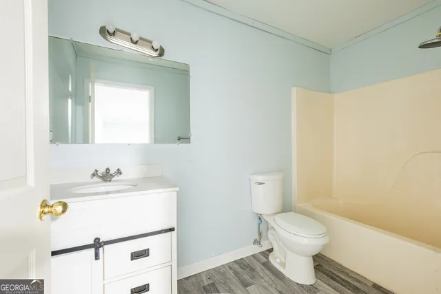 an aerial view of a houses with a yard