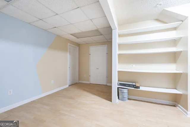 an aerial view of a forest with houses