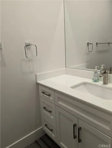 a bathroom with a sink and vanity