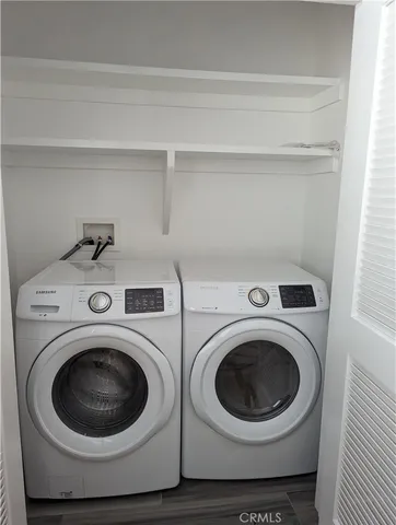 a utility room with dryer and washer