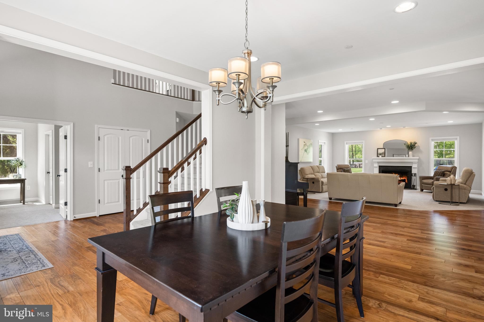 413 Vierling Drive Silver Spring, MD 20904 - Photo 12 of 82 a view of a dining room and livingroom with furniture wooden floor a chandelier