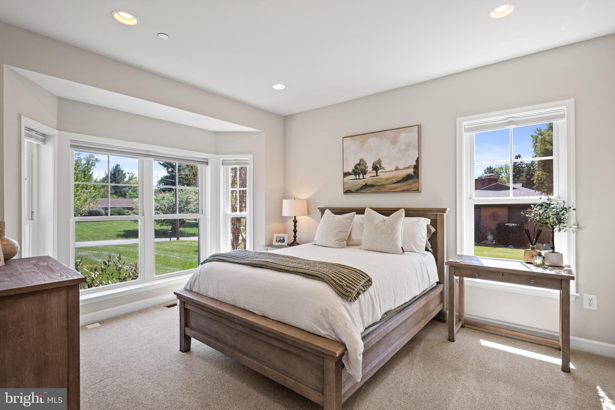 413 Vierling Drive Silver Spring, MD 20904 - Photo 26 of 82 a spacious bedroom with a bed and a large window