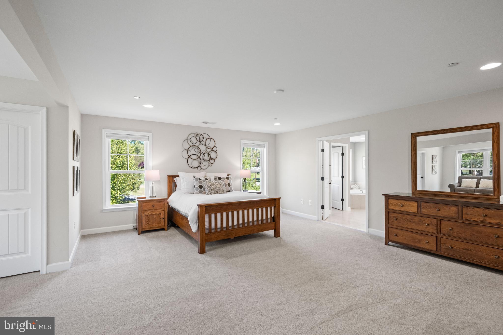 413 Vierling Drive Silver Spring, MD 20904 - Photo 40 of 82 a spacious bedroom with a bed and a window