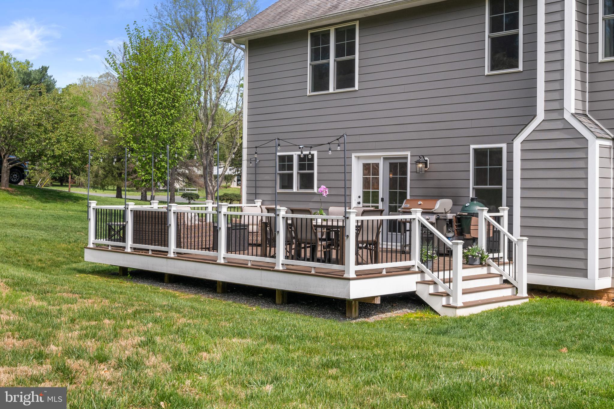 413 Vierling Drive Silver Spring, MD 20904 - Photo 78 of 82 a view of a house with a wooden deck and a yard