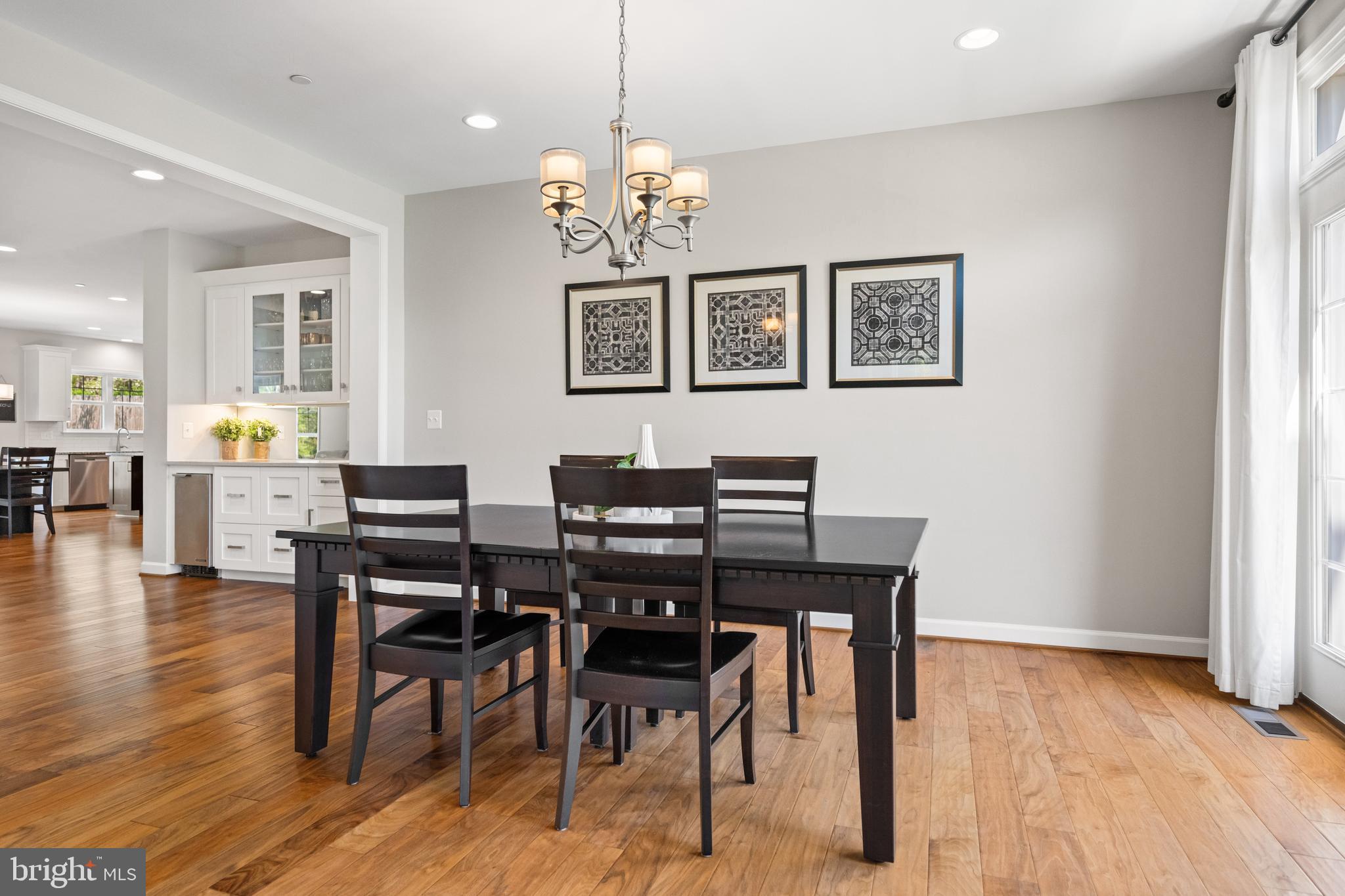 413 Vierling Drive Silver Spring, MD 20904 - Photo 10 of 82 a view of a dining room with furniture wooden floor and chandelier