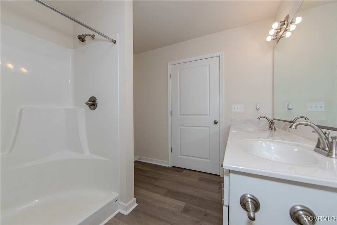 14671 Baltimore Road Dewitt, VA 23840 - Photo 11 of 27 a bathroom with a shower a mirror and a sink