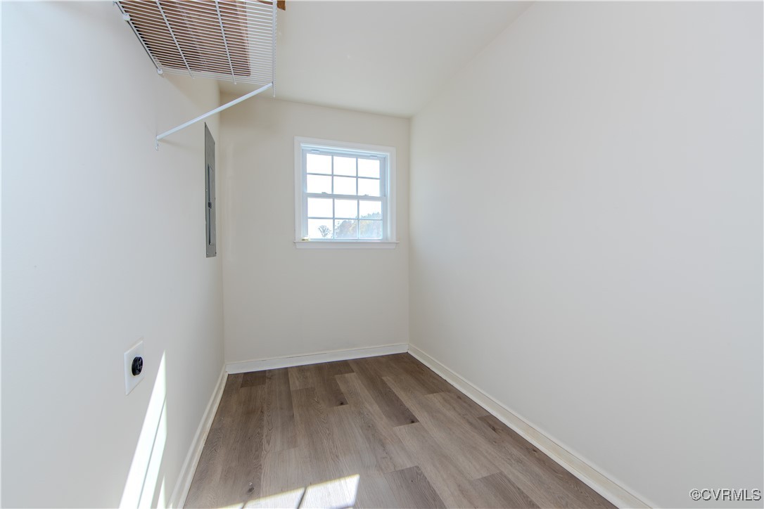 14671 Baltimore Road Dewitt, VA 23840 - Photo 19 of 27 an empty room with wooden floor and windows