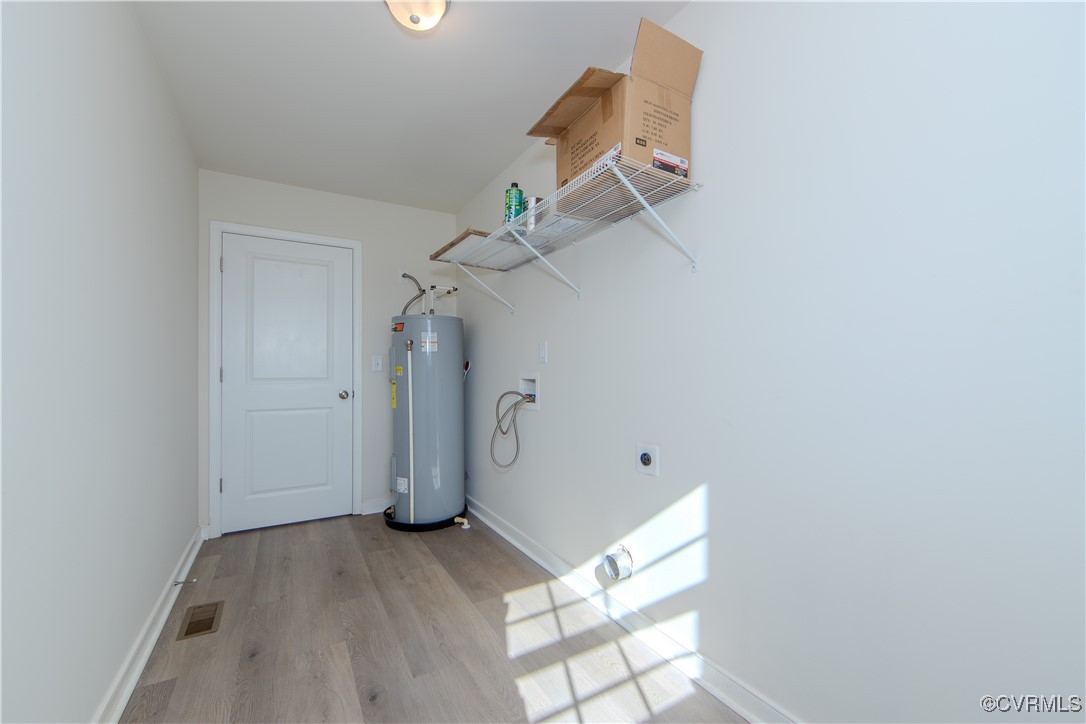 14671 Baltimore Road Dewitt, VA 23840 - Photo 20 of 27 a view of a room with wooden floor and white walls