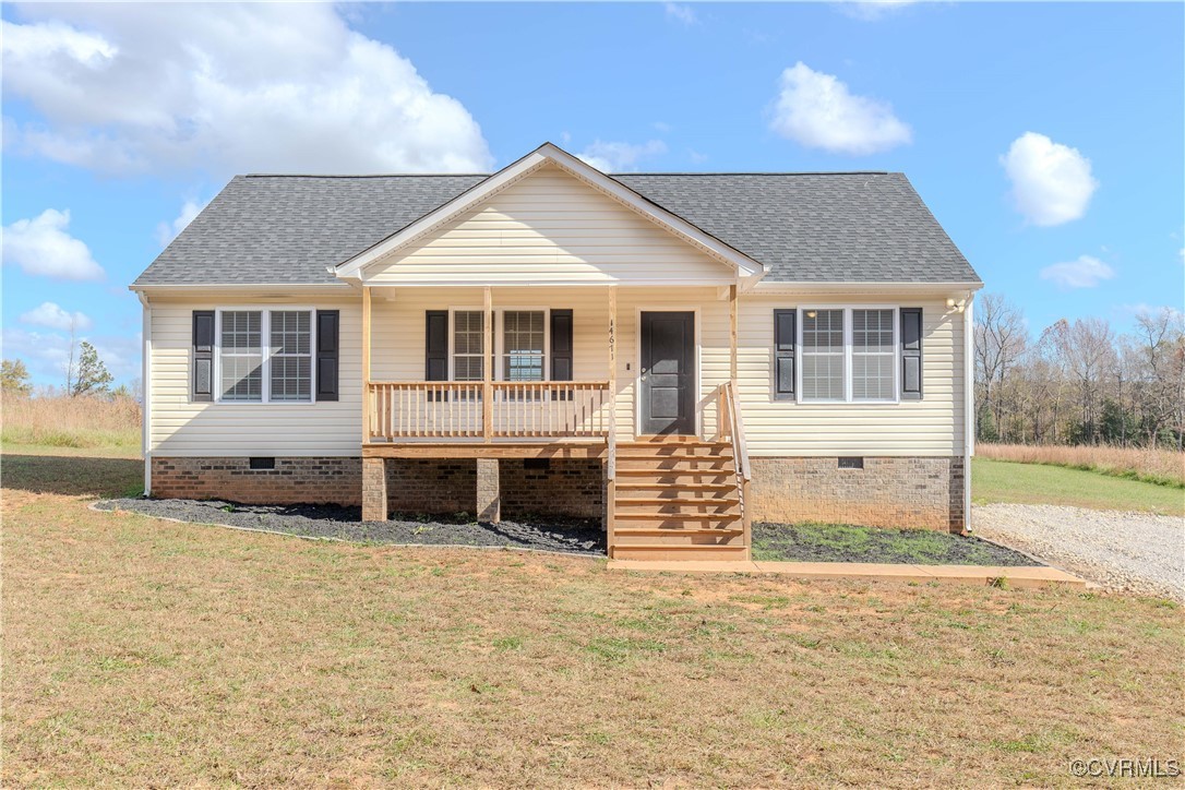 14671 Baltimore Road Dewitt, VA 23840 - Photo 2 of 27 a front view of a house with a yard