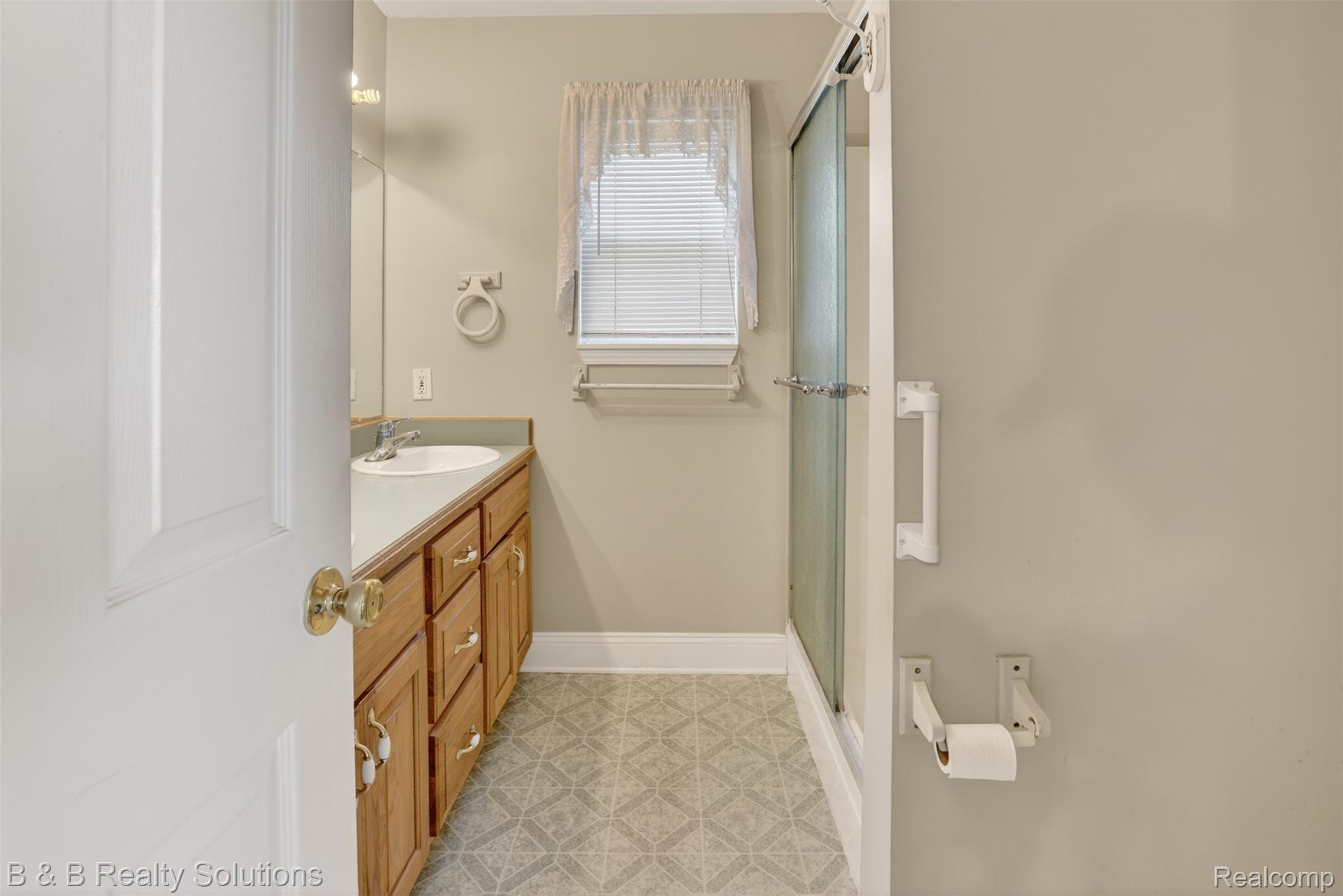 6100 Fish Lake Road North Branch, MI 48461 - Photo 18 of 45 Bathroom featuring a stall shower, vanity, and light floors