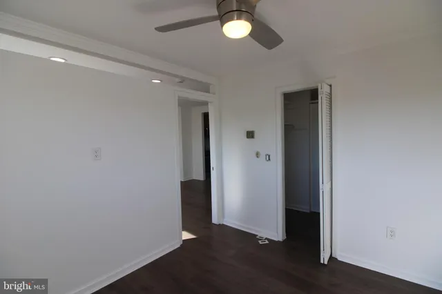 an empty room with wooden floor