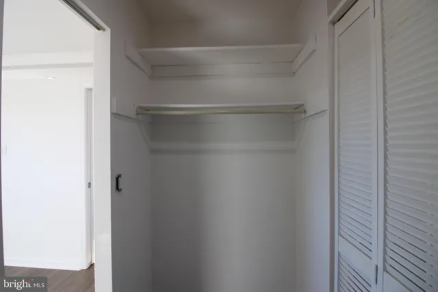 a view of an empty walk in closet