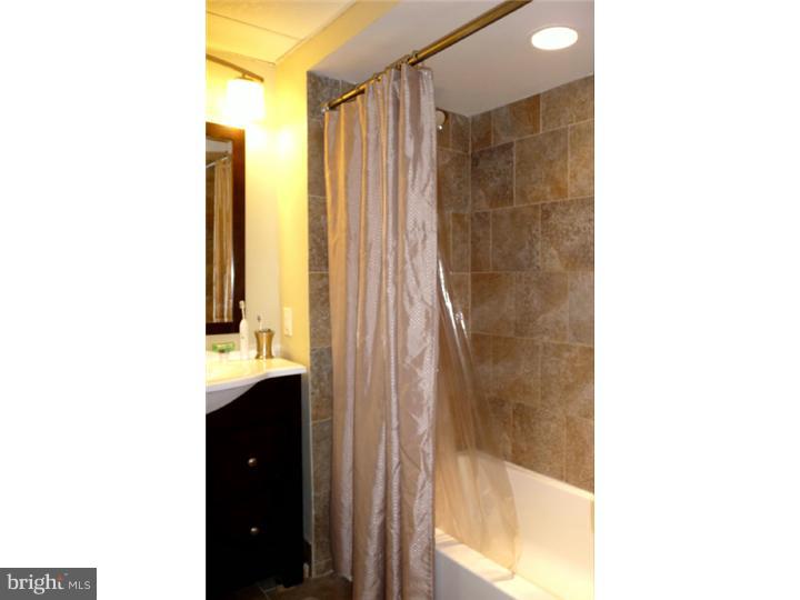 120 Paine Street Riverside, NJ 08075 - Photo 8 of 13 a bathroom with a shower and a sink