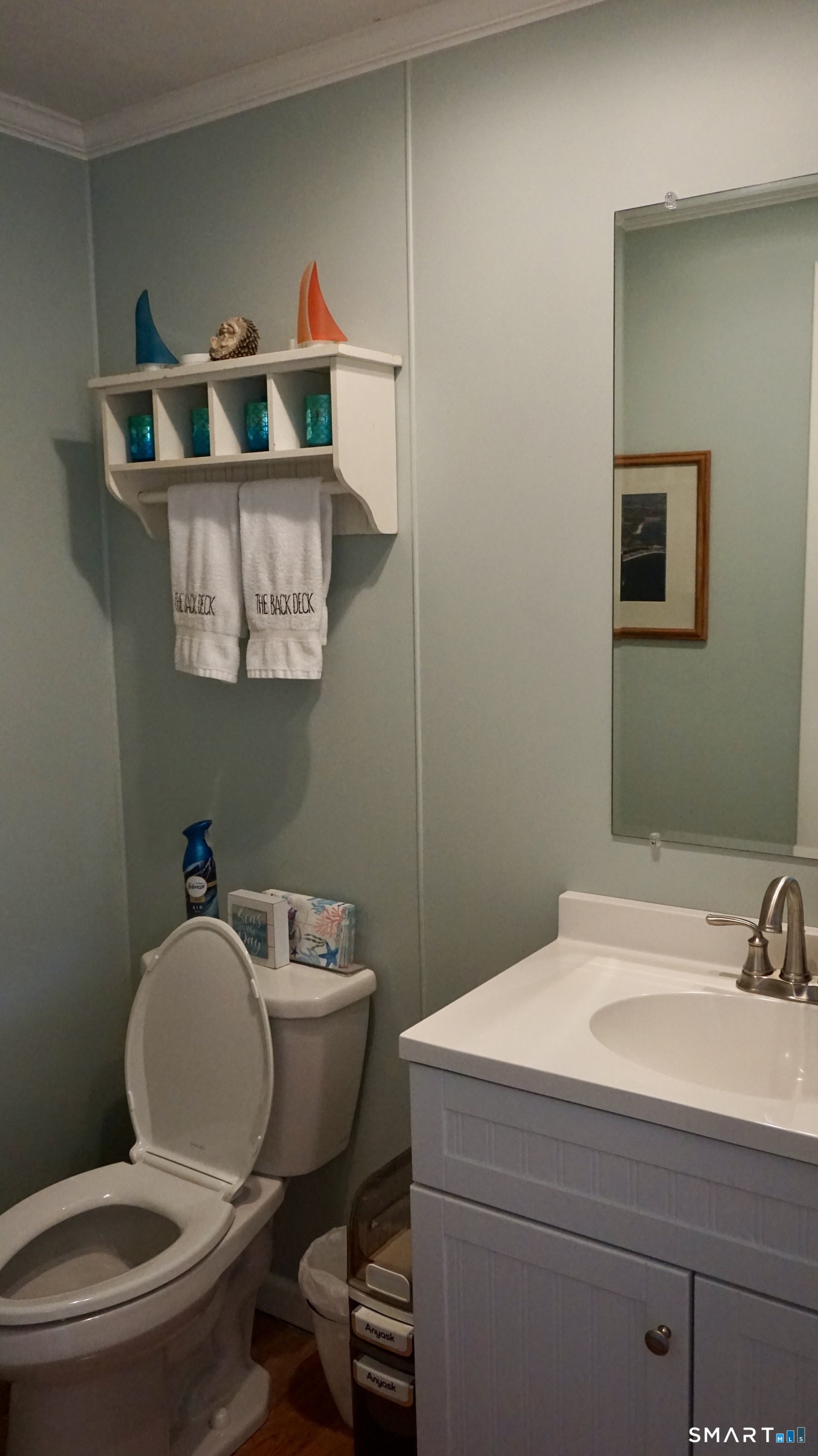 13 Pacific Street Groton, CT 06340 - Photo 15 of 31 a bathroom with a toilet sink and mirror