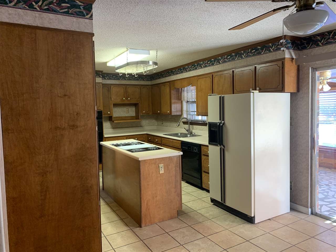 483 Kinser Road Cleveland, TN 37323 - Photo 7 of 40 a kitchen with a refrigerator sink and stove