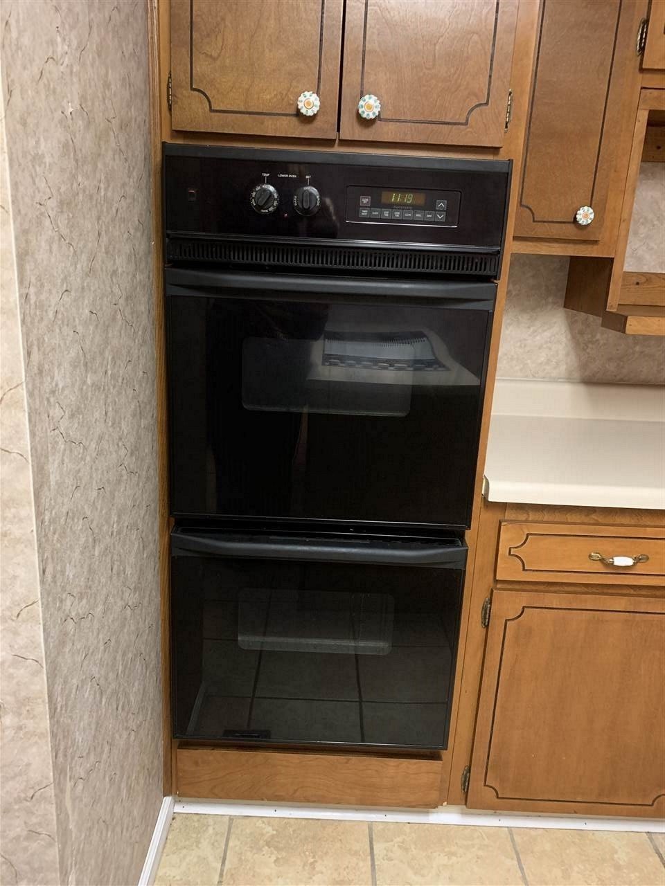 483 Kinser Road Cleveland, TN 37323 - Photo 9 of 40 a stove top oven sitting inside of a kitchen