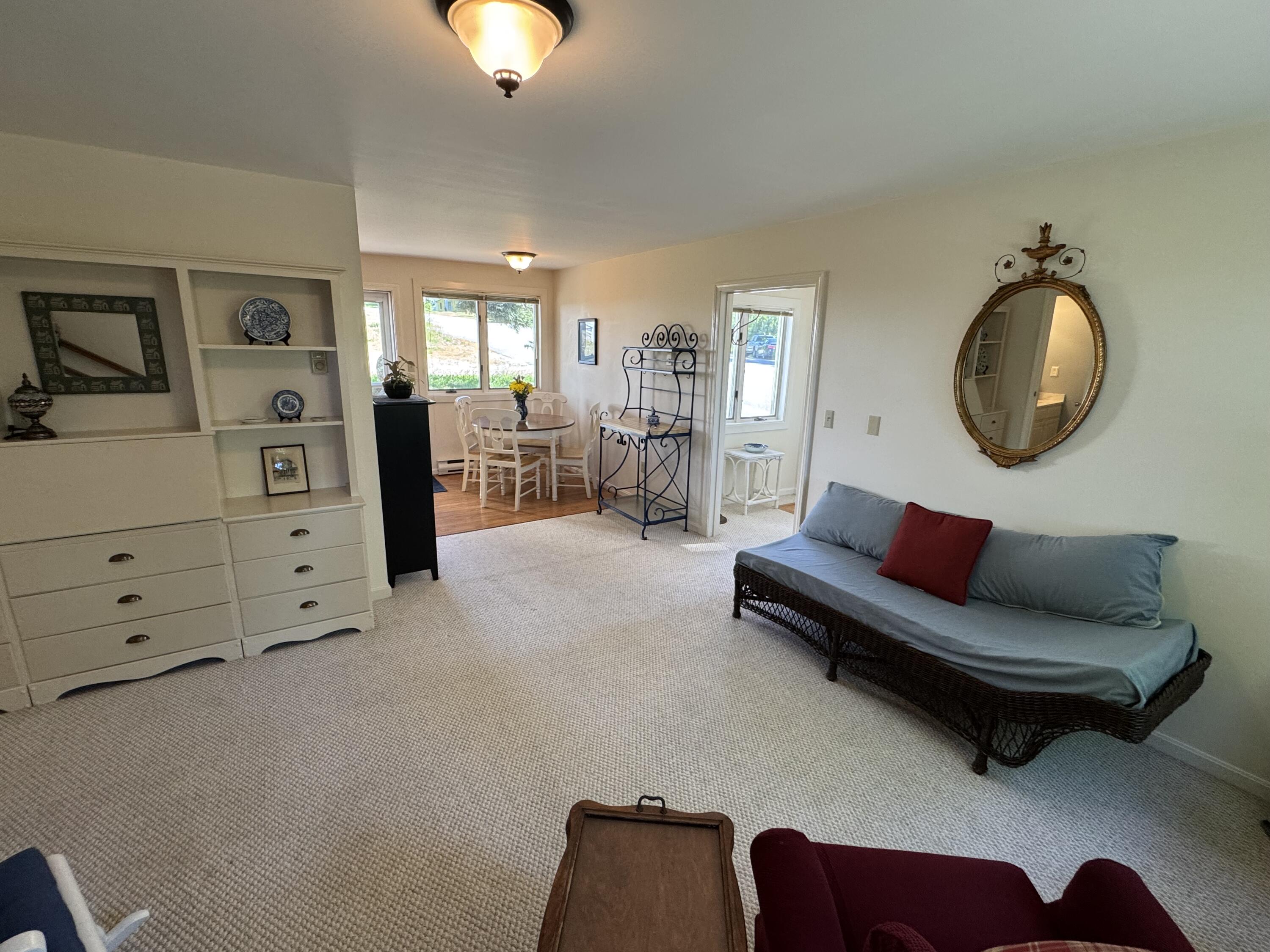 1 West Harbor Pond Road, Unit 1 West Boothbay Harbor, ME 04575 - Photo 9 of 24 Living room to dining area