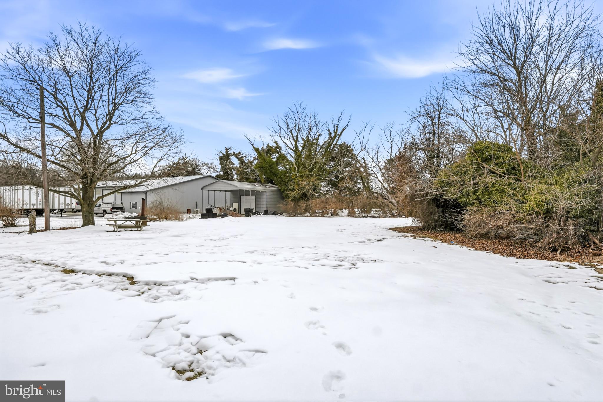 4 Townsend Avenue Bridgeton, NJ 08302 - Photo 35 of 38 Serene winter landscape with a cozy home.