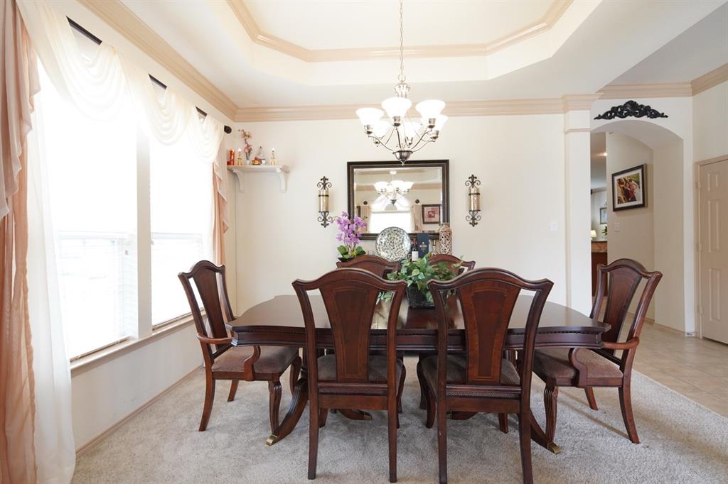 4508 Fox Rio Trail Arlington, TX 76017 - Photo 4 of 28 a view of a dining room with furniture and chandelier