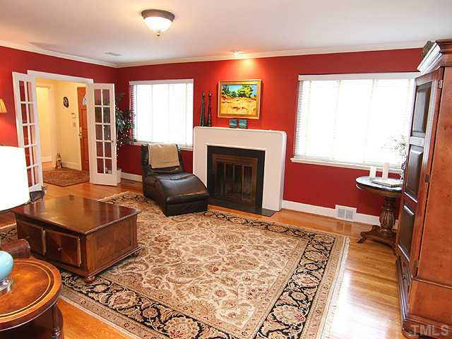 3015 Ruffin Street Raleigh, NC 27607 - Photo 4 of 25 Imagine yourself in this beautiful living area enjoying the wonderful fireplace with family and friends! Two large windows make this a bright room. Beautiful crown molding, hardwood floors, and french doors. Other