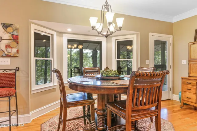 a dining room with furniture and window