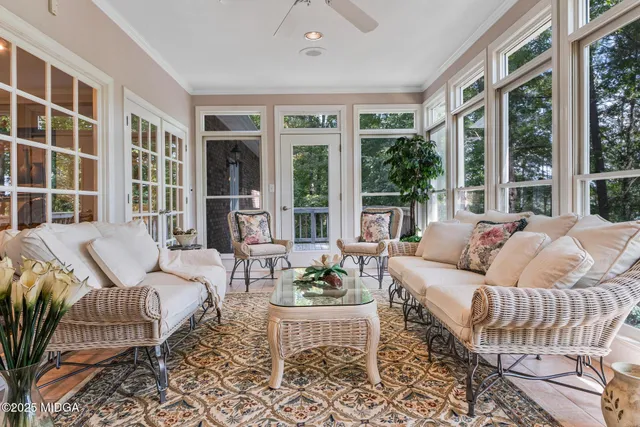 a view of a patio with a table and chairs