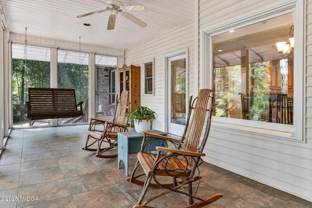a bathroom with a toilet a sink and a mirror
