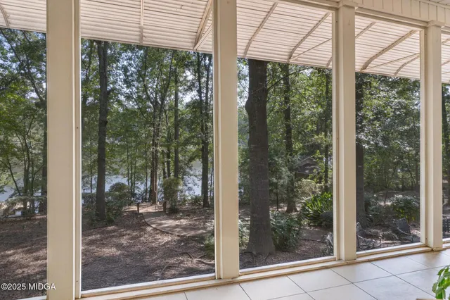 a bathroom with a sink a vanity and a large mirror