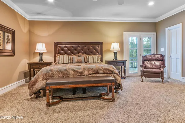 a view of living room with furniture and large window