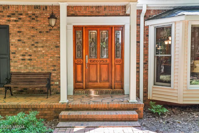 a view of a entryway door front of house