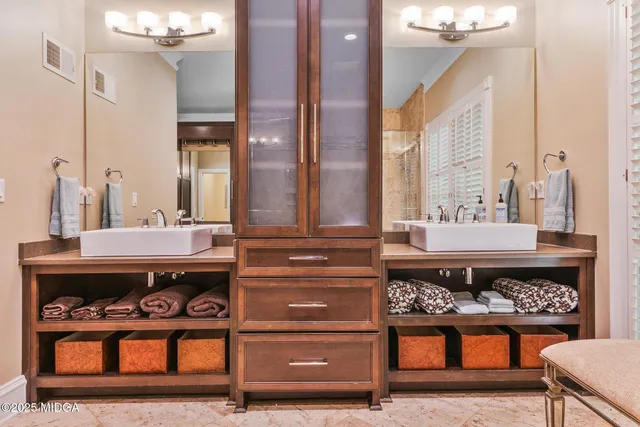 a bathroom with a sink a mirror and a shower