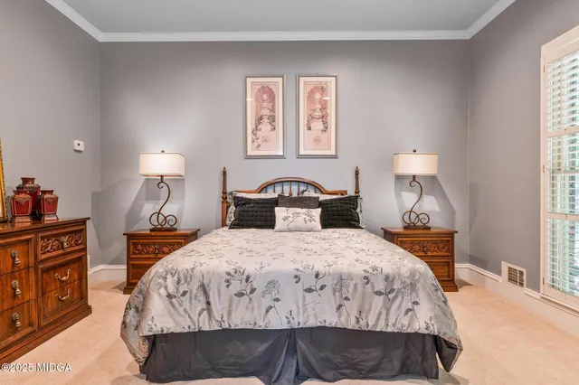 a living room with furniture a window and a chandelier