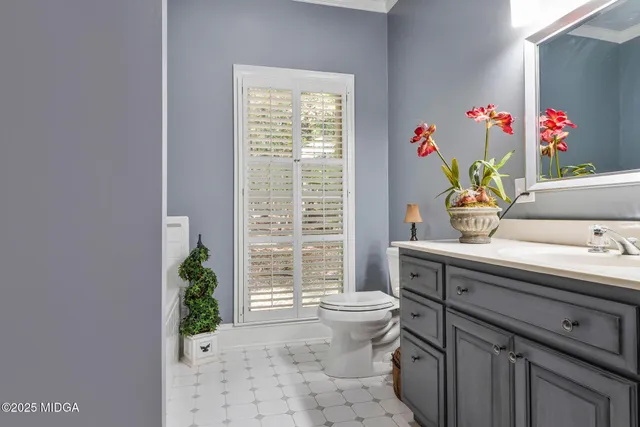 a bedroom with furniture and wooden floor